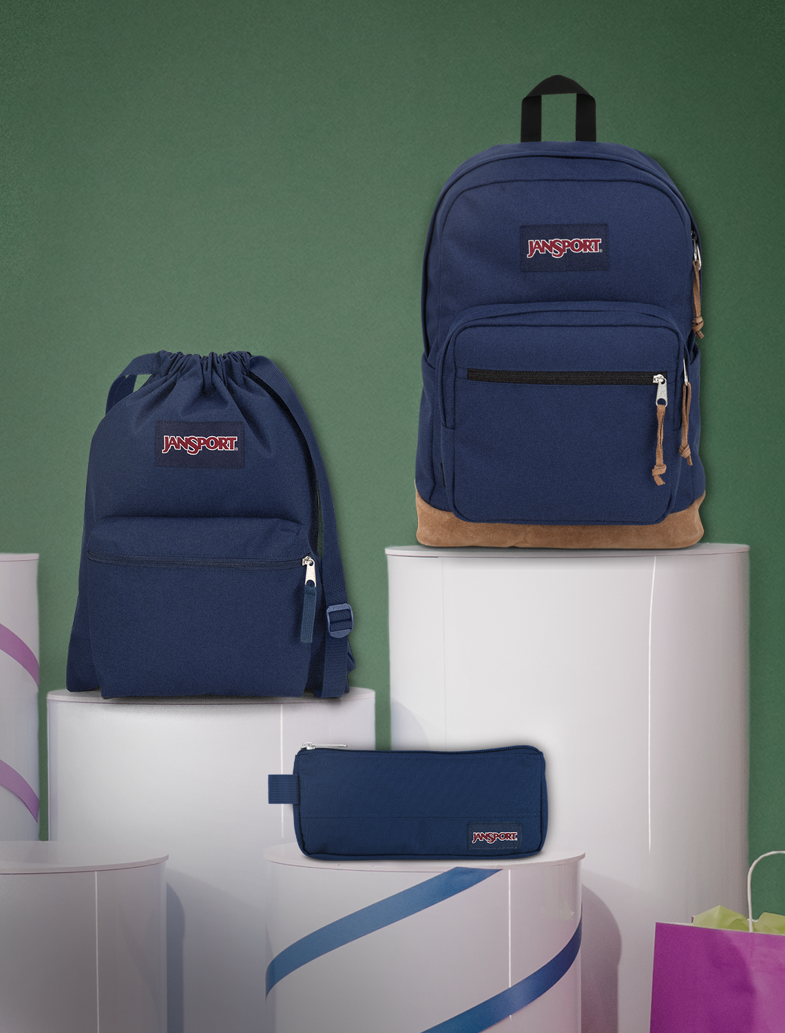 Navy blue backpacks with JanSport logo on a green and white background